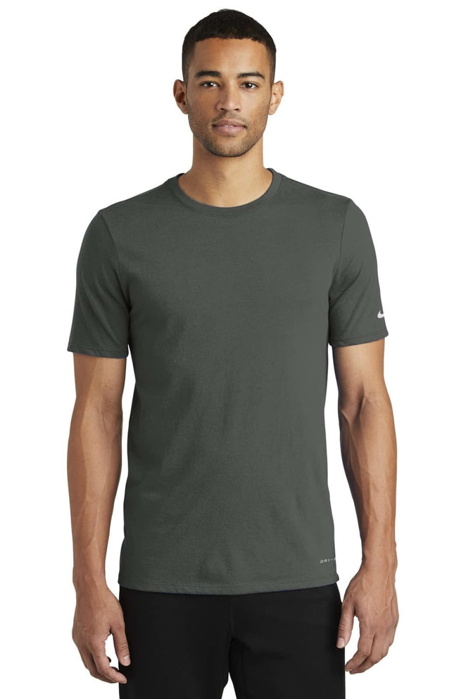 A short-sleeved, olive green Nike Dri-FIT T-shirt with a subtle logo on the sleeve. A short-sleeved, olive green Nike Dri-FIT T-shirt with a subtle logo on the sleeve.