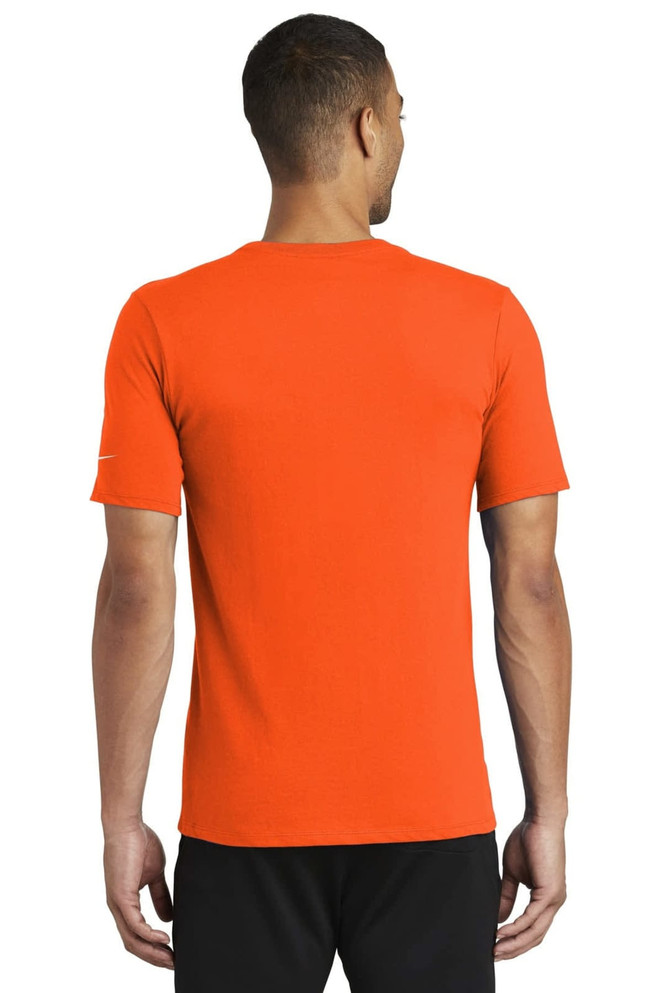 An orange Nike Dri-FIT cotton/poly T-shirt displayed from the back, featuring a logo on the sleeve. An orange Nike Dri-FIT cotton/poly T-shirt displayed from the back, featuring a logo on the sleeve.
