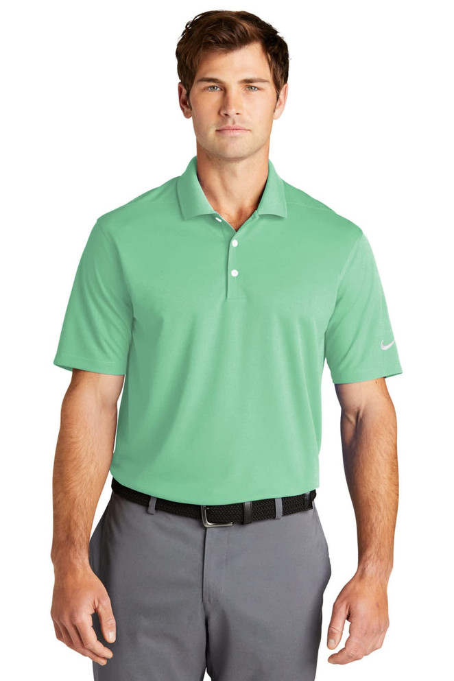 A mint green Nike Dri-FIT Micro Pique 2.0 Polo with a collar and short sleeves, featuring a logo on the sleeve.