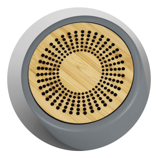 A Bluetooth mini speaker featuring a grey base and a bamboo grill with circular perforations. It has a branding logo. A Bluetooth mini speaker featuring a grey base and a bamboo grill with circular perforations. It has a branding logo.
