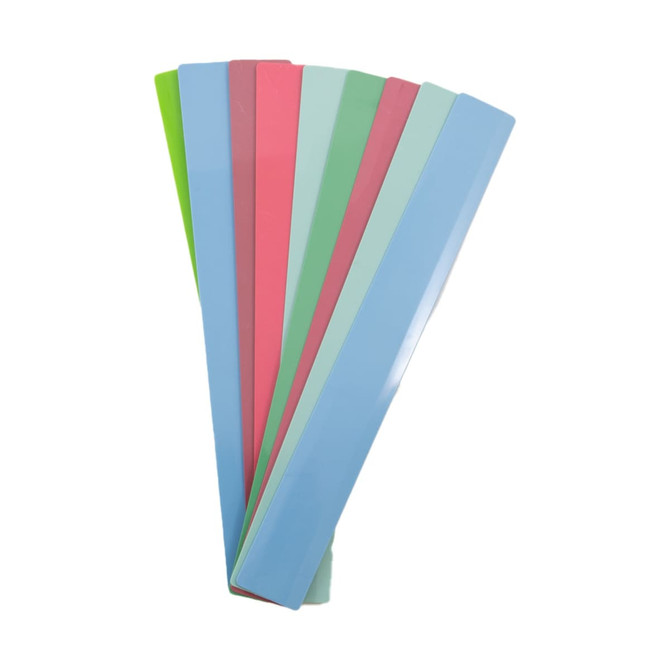 A set of multi-colored recycled plastic rulers, including shades of blue, green, pink, and mint green, stacked together. A set of multi-colored recycled plastic rulers, including shades of blue, green, pink, and mint green, stacked together.