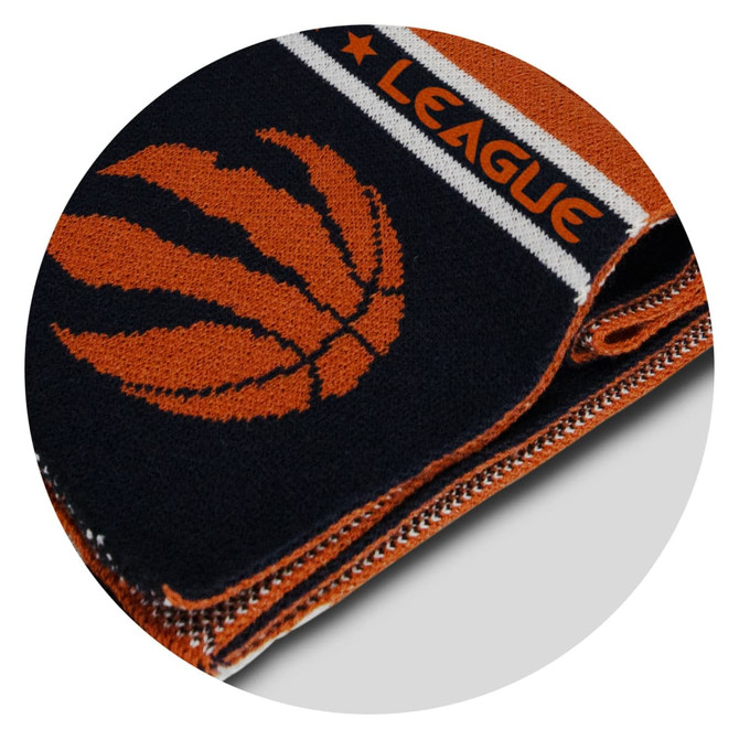 A knitted scarf in navy blue and orange, featuring a basketball design and an emblem. It has a logo on it. A knitted scarf in navy blue and orange, featuring a basketball design and an emblem. It has a logo on it.