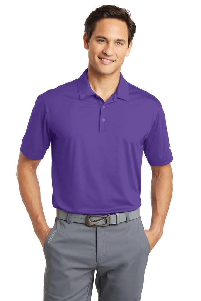 A purple Nike Dri-FIT Vertical Mesh Polo shirt displayed on a model, featuring a logo on the chest.