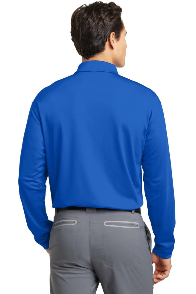 A back view of a blue long sleeve polo shirt with a logo, paired with grey trousers.