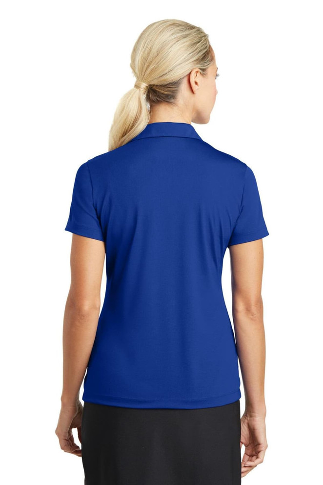 A blue Nike Ladies Dri-FIT Vertical Mesh Polo shirt viewed from the back. Features a collar and short sleeves. A blue Nike Ladies Dri-FIT Vertical Mesh Polo shirt viewed from the back. Features a collar and short sleeves.