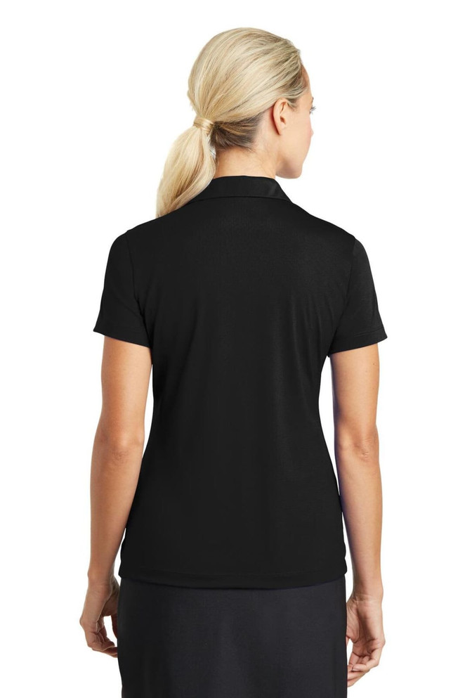 A black ladies' polo shirt with a short sleeve and a subtle logo on the back. A black ladies' polo shirt with a short sleeve and a subtle logo on the back.