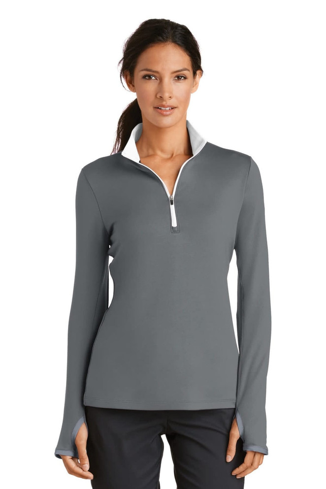 A grey ladies' 1/2-zip cover-up featuring long sleeves and a white collar, with branding visible.