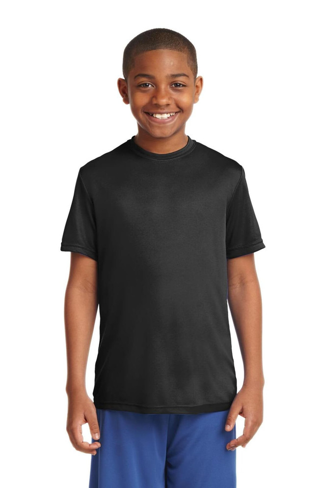 A youth in a black short-sleeve T-shirt stands, smiling. The T-shirt features a logo. A youth in a black short-sleeve T-shirt stands, smiling. The T-shirt features a logo.