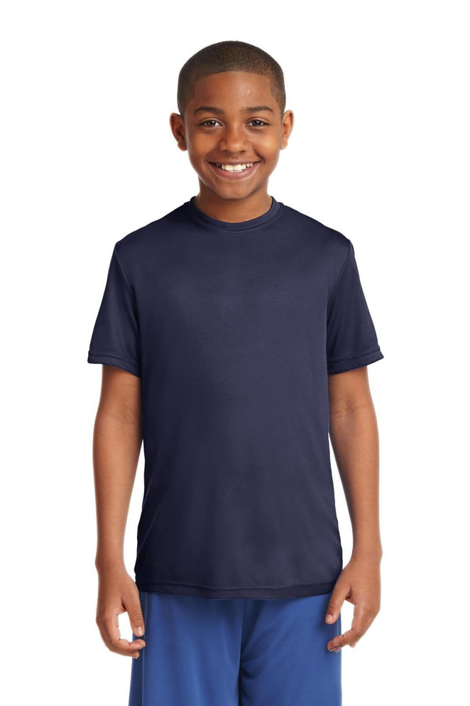 A young boy smiles while wearing a navy blue Sport-Tek Youth PosiCharge Competitor Tee. The shirt has a logo. A young boy smiles while wearing a navy blue Sport-Tek Youth PosiCharge Competitor Tee. The shirt has a logo.