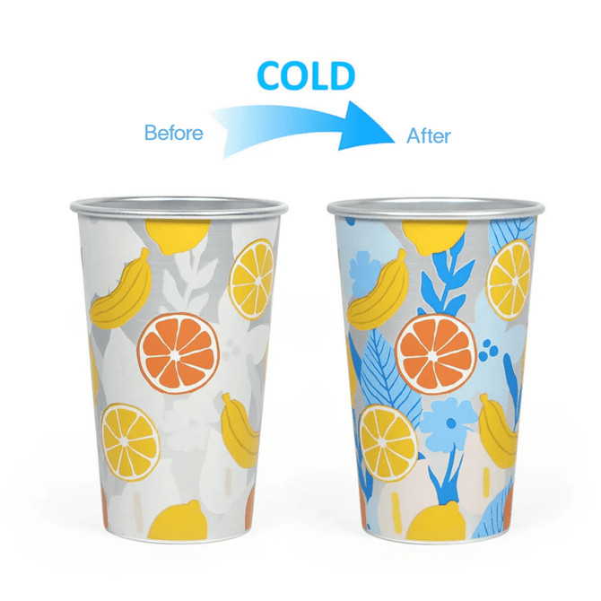 A drink cup featuring a colour-changing design with fruits and flowers in bright colours. The cup has a logo.