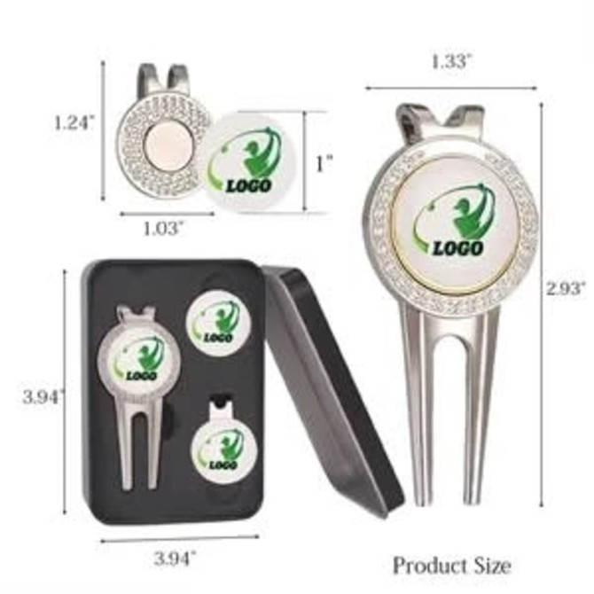 A golf divot tool in silver with three round ball markers, all in a compact black case with a logo.
