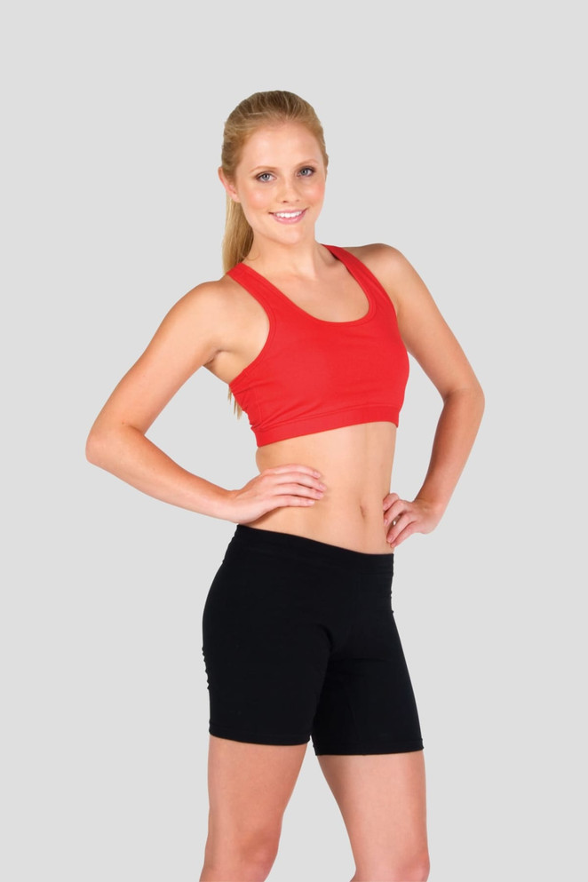 A red crop top with a fitted design, paired with black shorts, showcased on a model against a grey background.