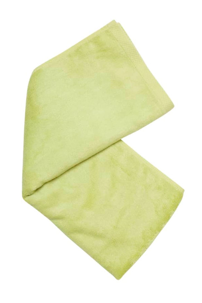 A folded bamboo fitness towel in a light green shade, featuring a logo.