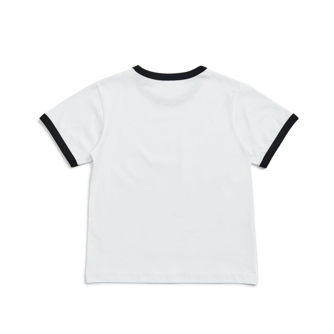 A kids' ringer tee in white with a black collar and sleeve edges, featuring a logo at the back. A kids' ringer tee in white with a black collar and sleeve edges, featuring a logo at the back.