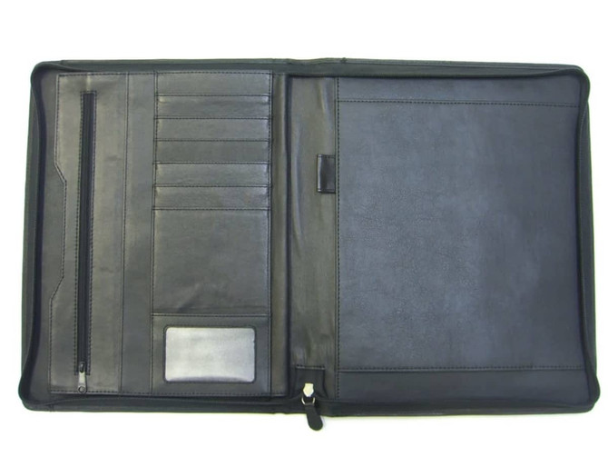 A4 leather compendium in black, featuring pockets, card slots, and a smooth finish. It has a zipped section.