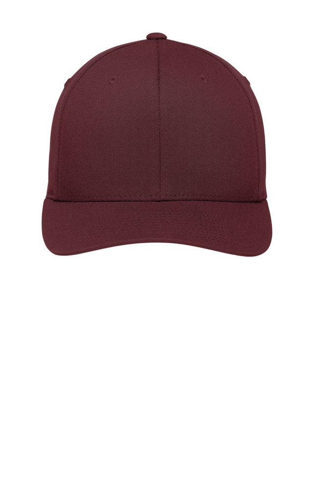 A maroon Port Authority Flexfit Cotton Twill Cap with a structured design and an adjustable fit, featuring a logo.