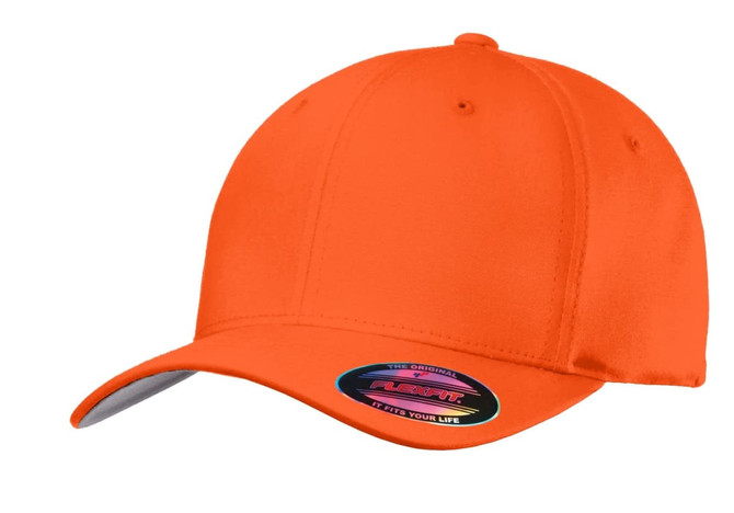 An orange Flexfit cotton twill cap with a curved brim and a logo on the side.