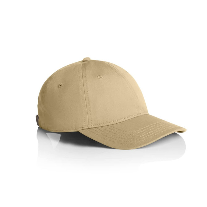 A beige cap with a curved peak, featuring a logo on the side and ventilation holes.