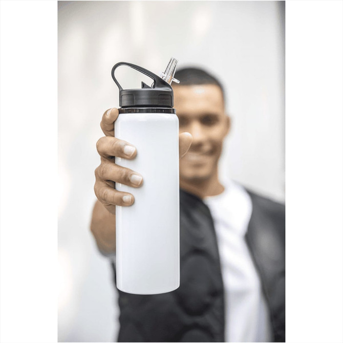 A drink bottle in white with a black lid and a built-in straw, held by a person. It has a logo on it.