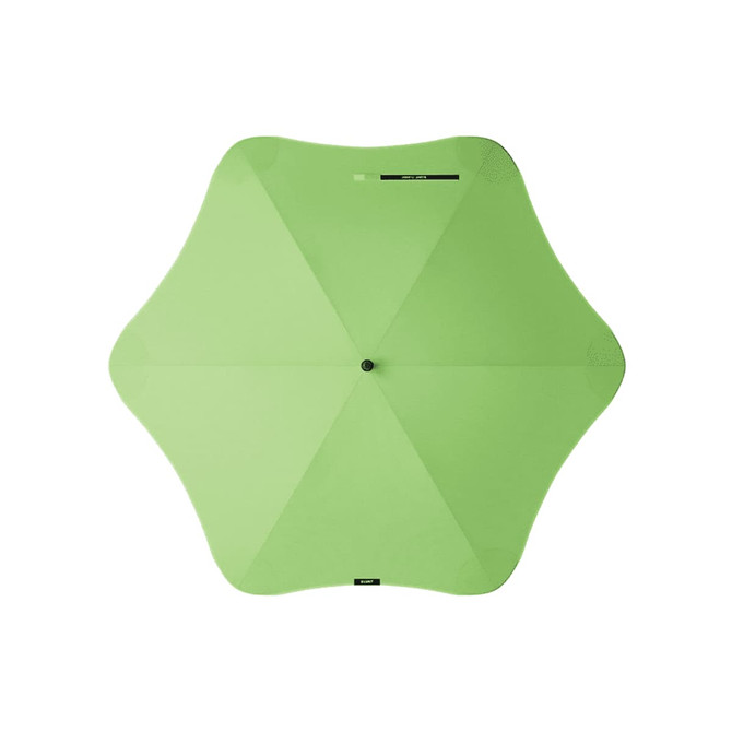 A green BLUNT Classic Umbrella with a unique star-shaped canopy. The umbrella features a central hub and has a logo.