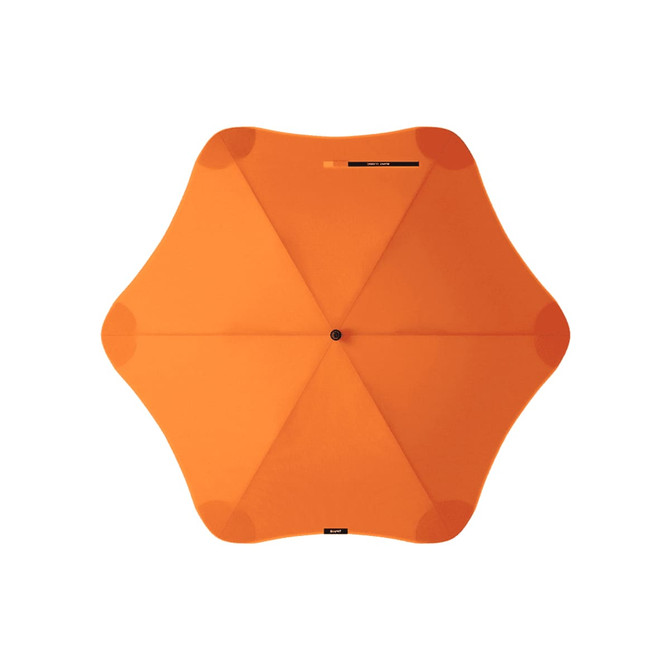 An orange BLUNT Classic Umbrella with a star-shaped canopy design and a central point. It features a logo.