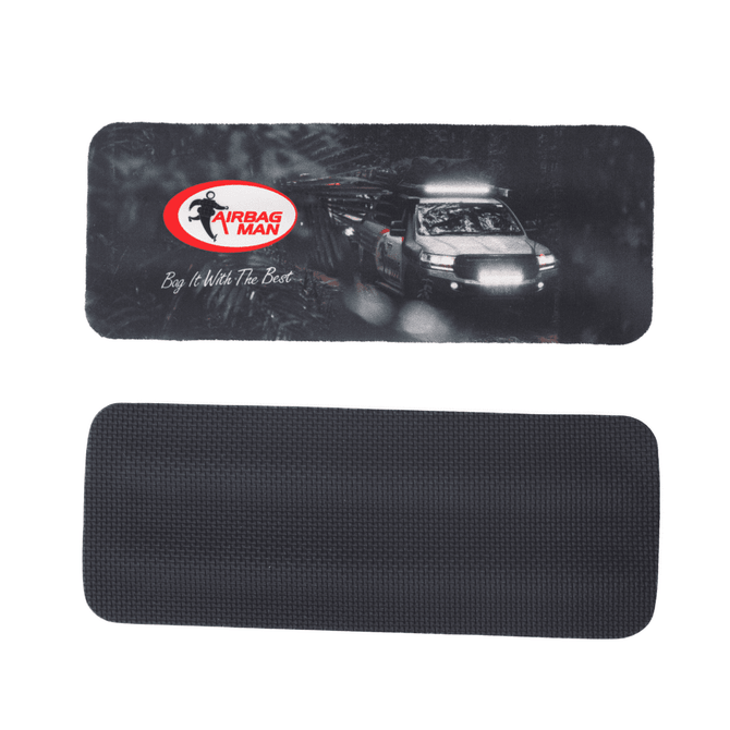 A drink bottle cooler featuring a black textured back and a front design with an image and logo.