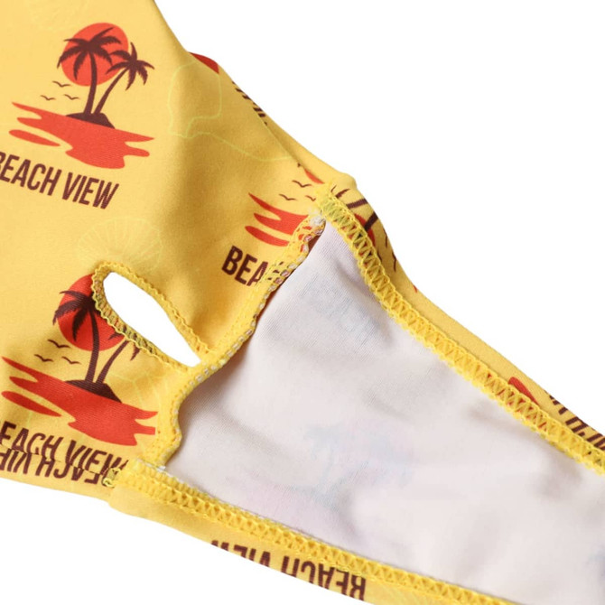 A yellow bikini top featuring a beach view design with palm trees and a logo.