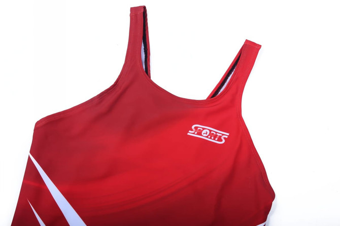 A red one-piece swimming costume with a sporty design and a logo on the front.