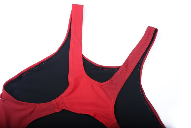 A red and black one-piece swimming suit with a logo, featuring adjustable straps and a sleek design.