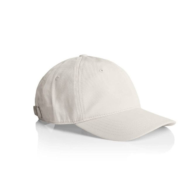 A beige cap with a curved brim and adjustable strap at the back, featuring a logo on the side.