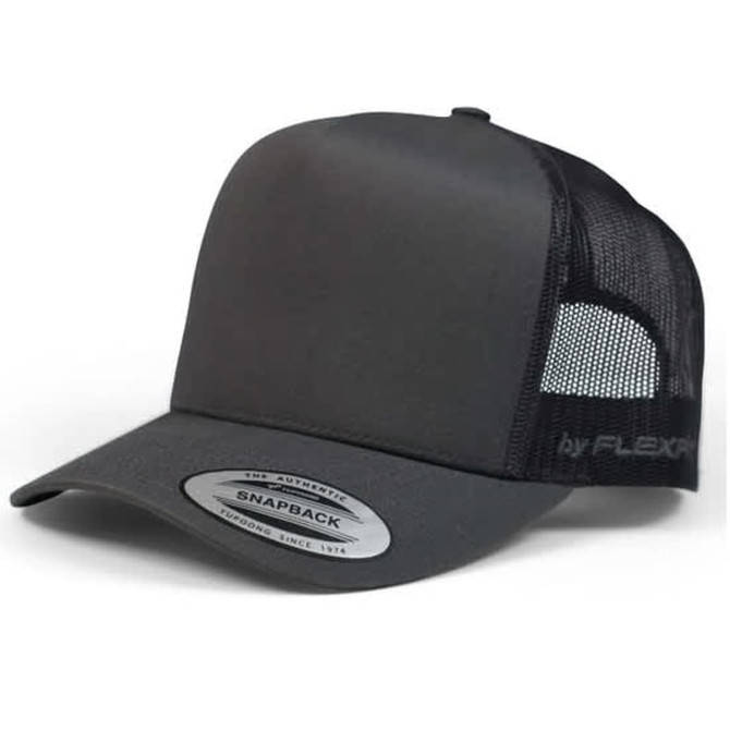 A black Yp Classic 6507 A Trucker Cap with a mesh back and snapback closure, featuring a logo.