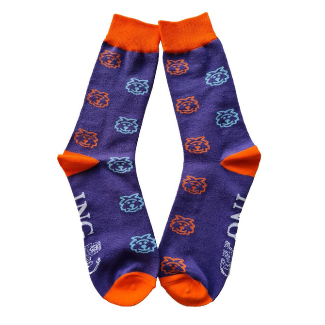 A pair of purple socks with orange cuffs and playful blue and orange lion motifs, featuring a logo.