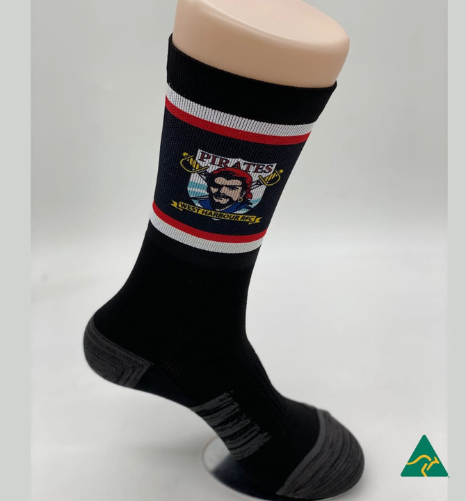 A black sock featuring a graphic design and contrasting red and grey stripes, displayed on a mannequin foot.