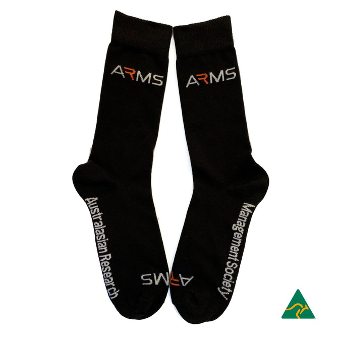 Black dress and business socks featuring logos in white and orange, with a branding label.