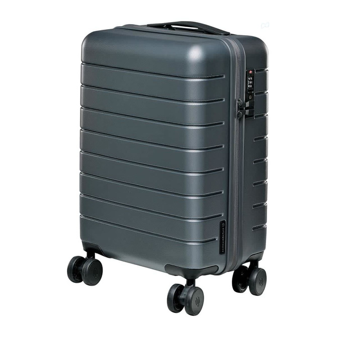 A grey wheeled carry-on suitcase with a textured exterior and four wheels for easy mobility.