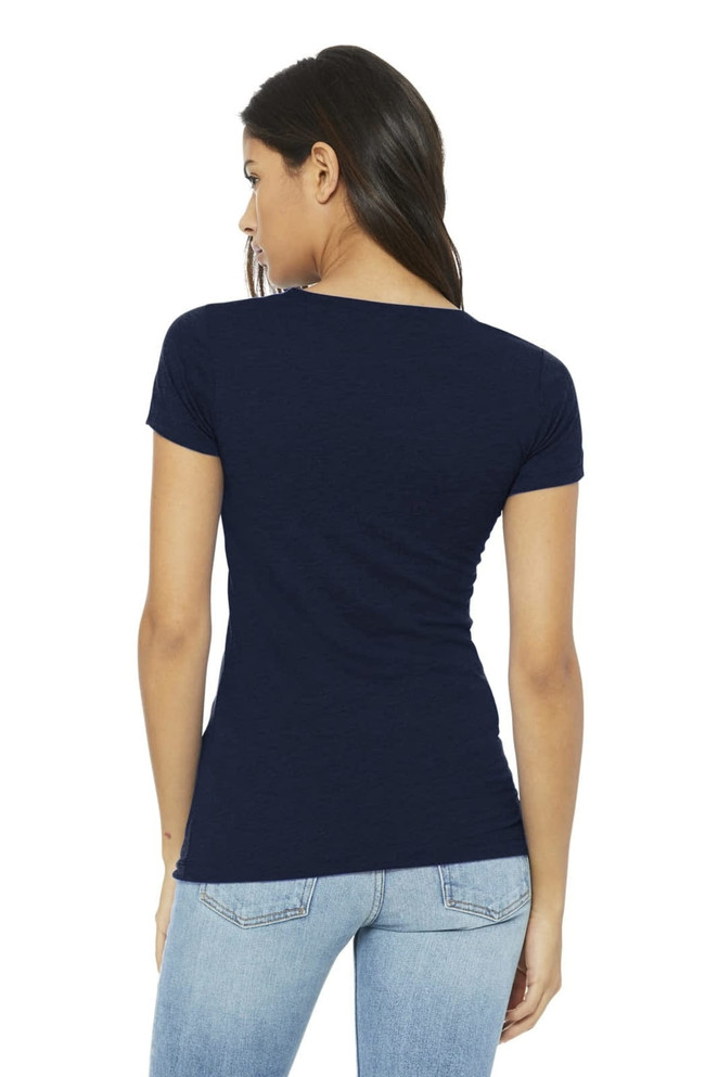 A back view of a woman wearing a navy blue t-shirt, styled with fitted jeans. The shirt features a logo.
