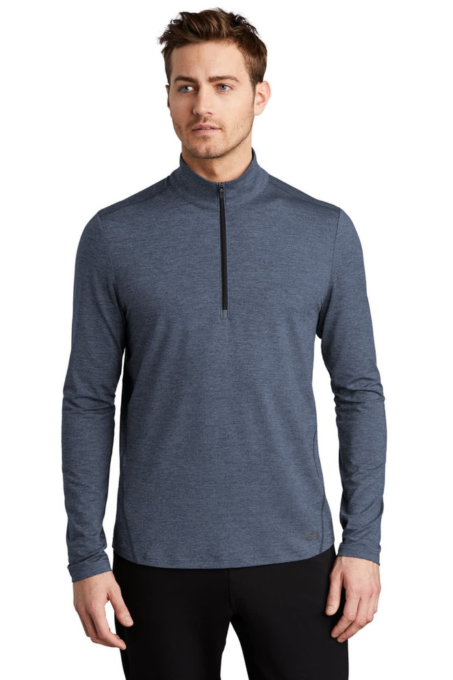 A long-sleeve, navy blue 1/4-zip top, featuring a collar and fitted design, with a logo on the garment.