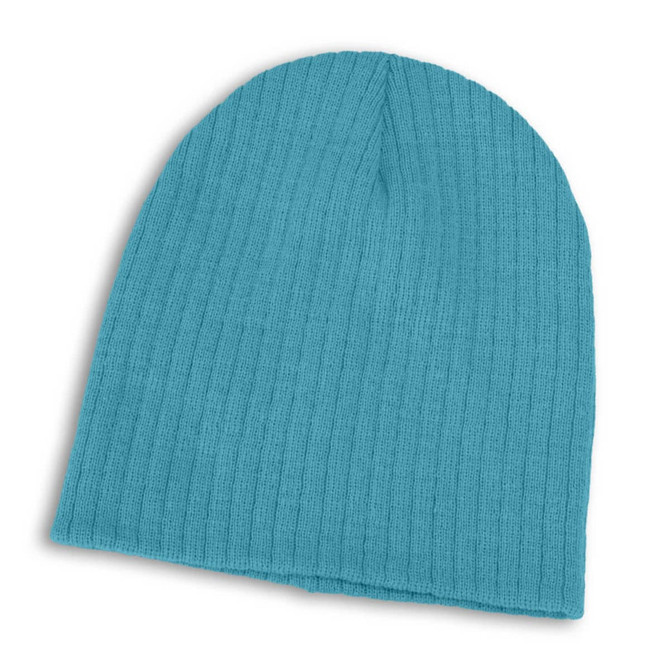 A Nebraska Cable Knit Beanie in a vibrant turquoise color, featuring a ribbed texture.