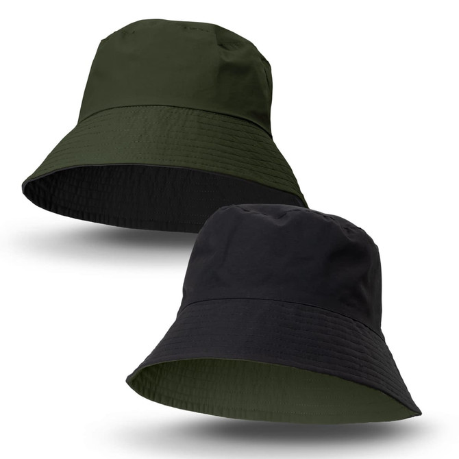 A reversible bucket hat in dark green and black, featuring a logo on one side.