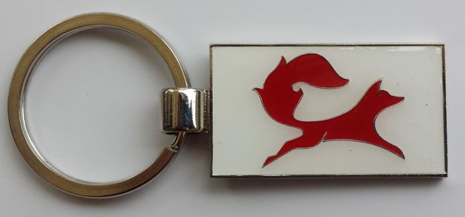 A silver keyring featuring a red soft enamel fox design on a white background, showcasing a polished finish.