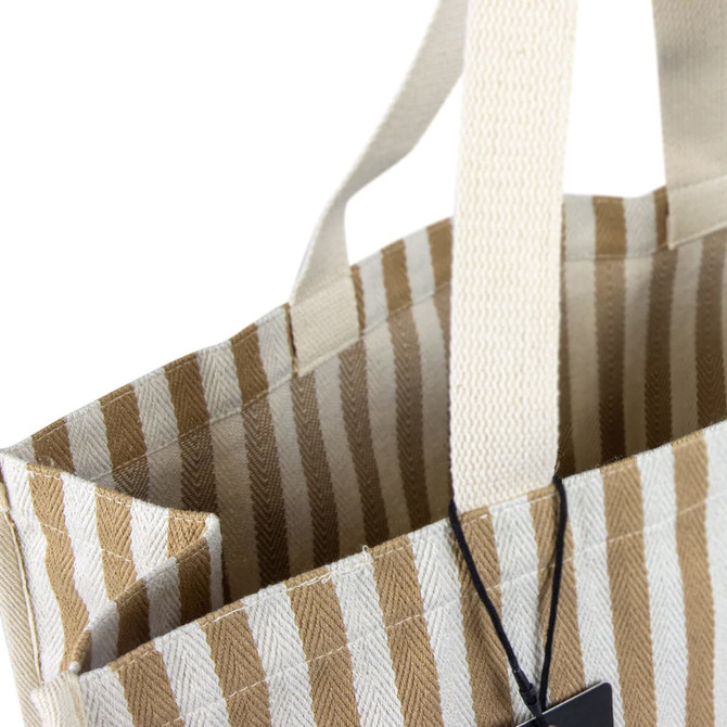 A striped beige and white tote bag with sturdy handles and an interior pocket, featuring a logo.