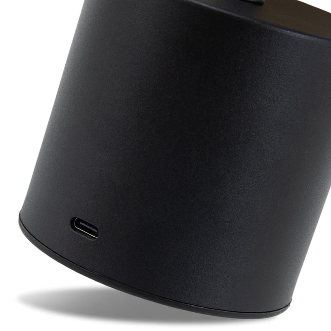 A black rechargeable table lamp with a USB-C charging port at the base, featuring a sleek cylindrical design.