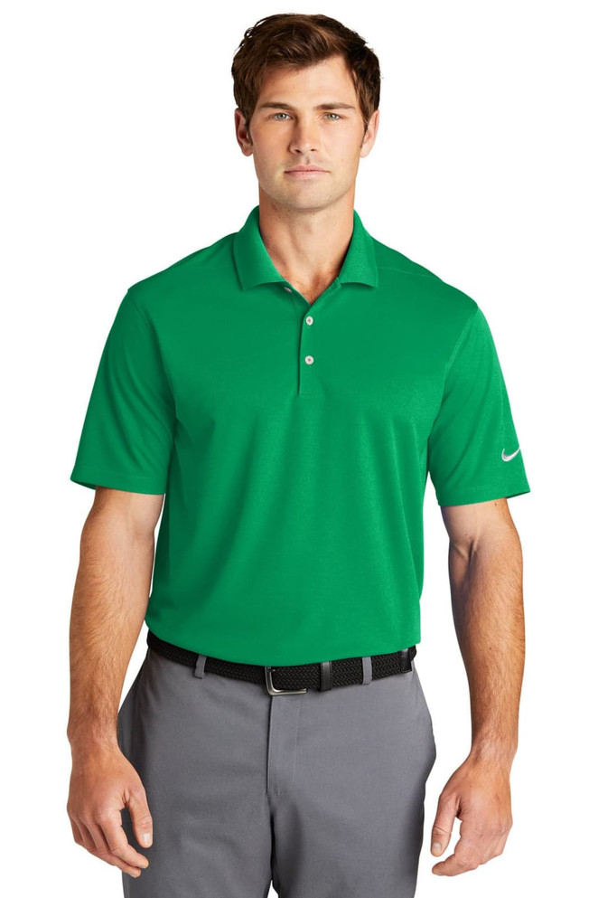 A green Nike Dri-FIT Micro Pique 2.0 polo shirt on a model, featuring a logo on the sleeve.