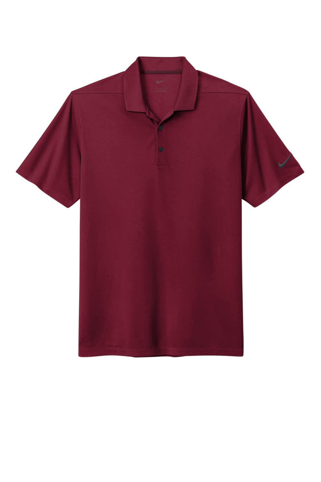 A maroon Nike Dri-FIT Micro Pique 2.0 Polo shirt with a logo on the sleeve. Short sleeve design.