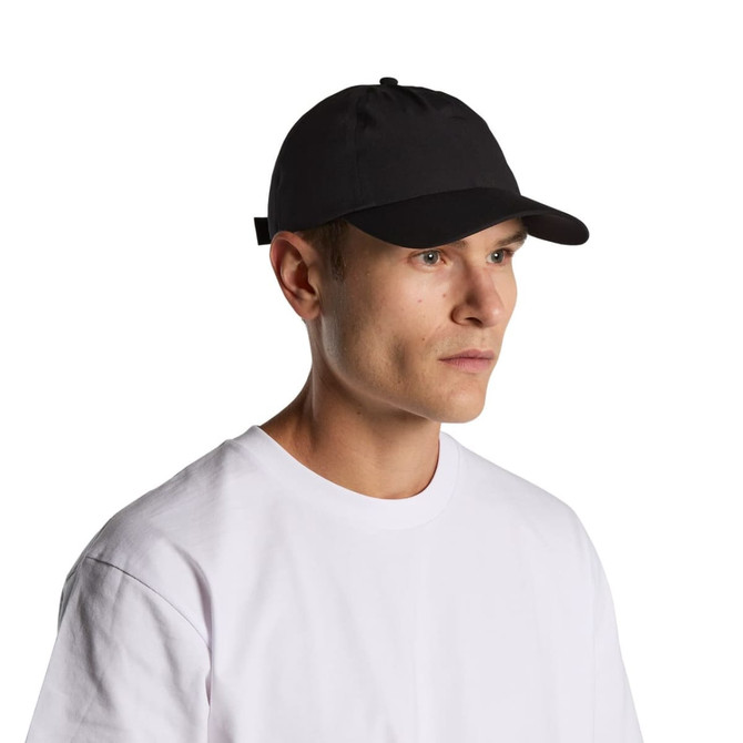 A black cap on a model wearing a white t-shirt, featuring a branding logo.
