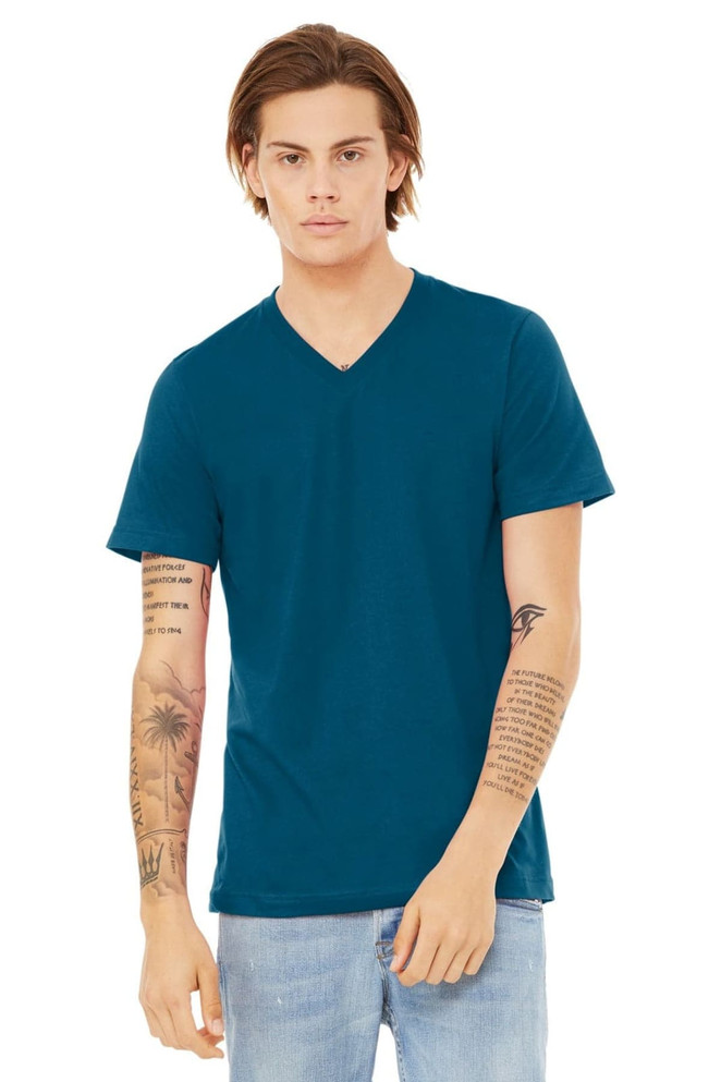 A model wearing a teal unisex jersey short sleeve v-neck tee, featuring a logo on the shirt.