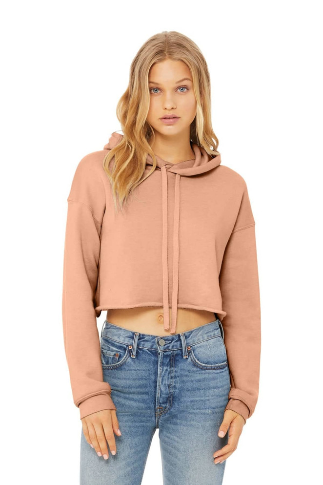 A cropped fleece hoodie in a soft beige colour, featuring a drawstring and long sleeves.