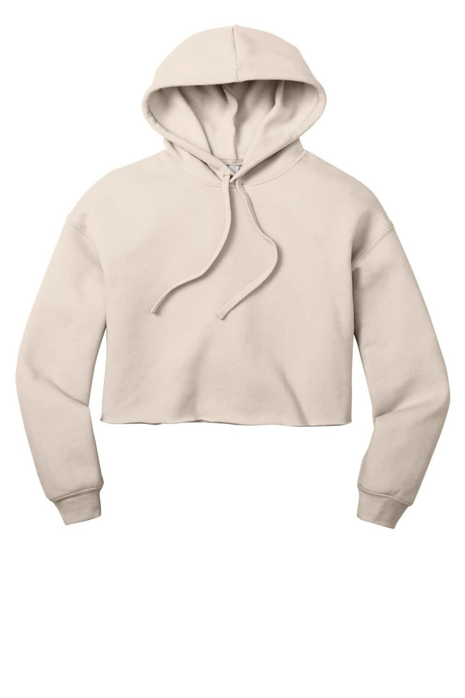 A cropped fleece hoodie in a soft beige colour, featuring a hood and drawstring. It has a logo on the garment.