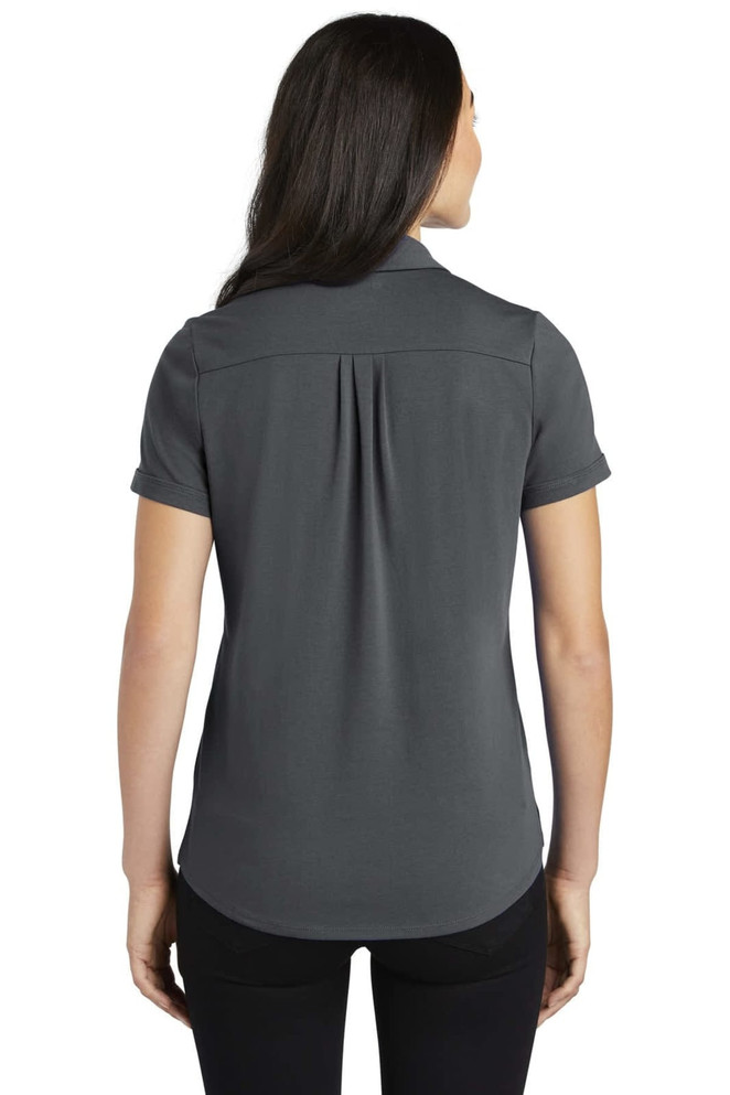 A grey ladies' polo shirt with a back pleat, featuring a collar and short sleeves, and a logo.