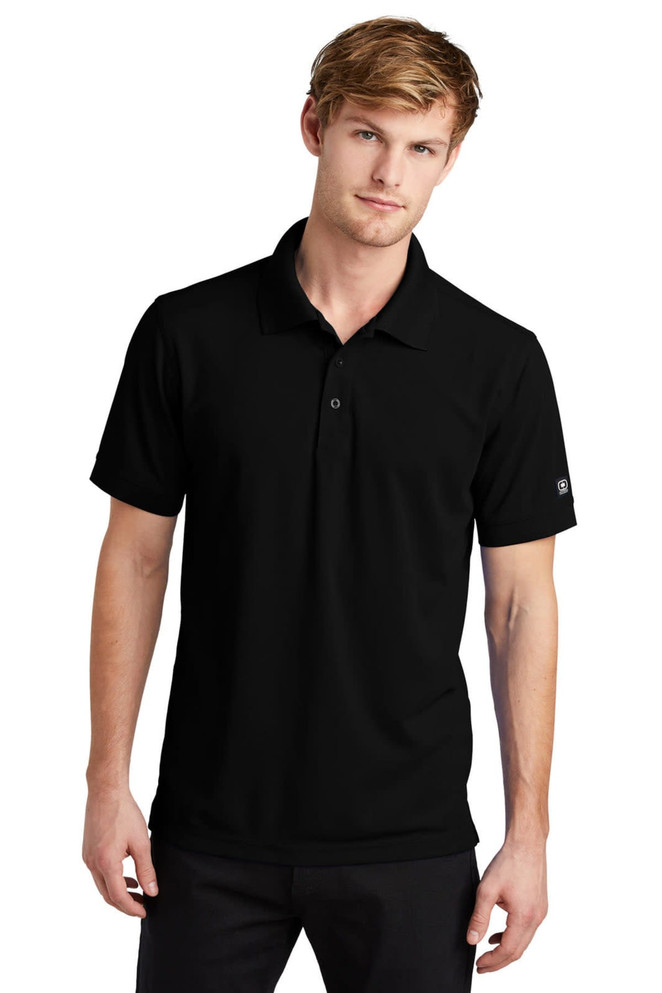 A black OGIO Caliber 2.0 polo shirt featuring a branded logo, designed for casual wear.